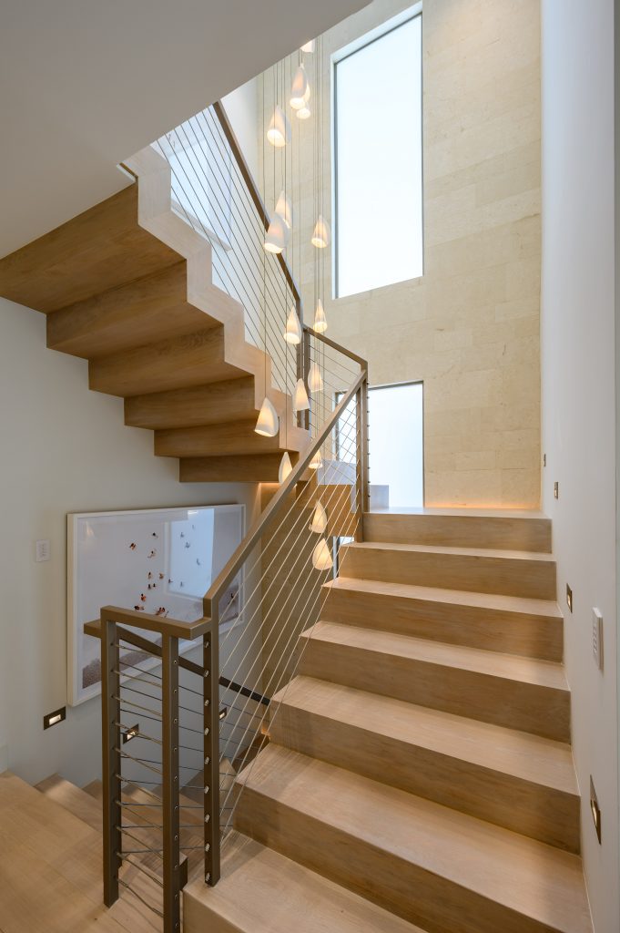 Floating wood stairs with light decor