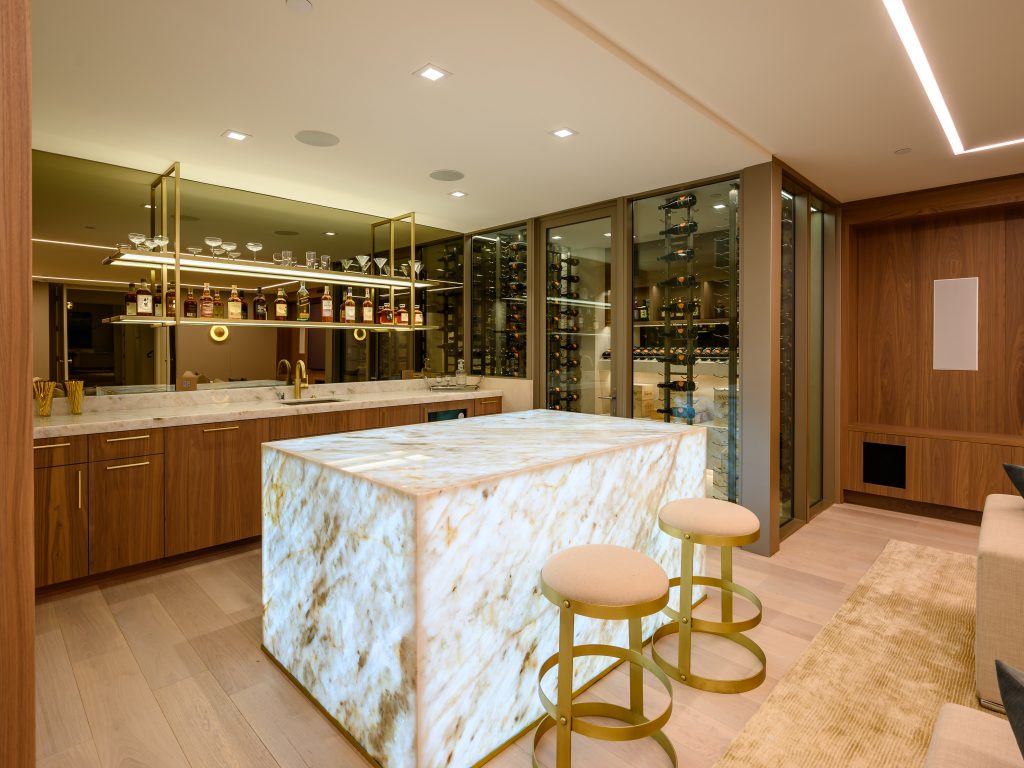 In-home bar of million dollar beach home featuring a unique square marble counter